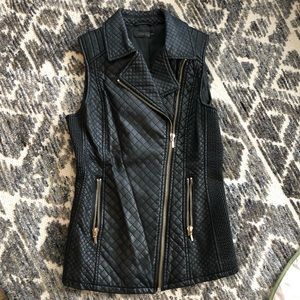 Cute quilted vegan leather moto vest with gold zipper detailing.  Size Small